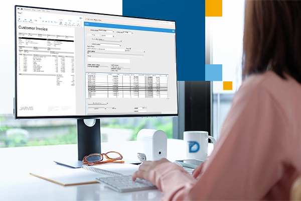 Woman using AI powered invoice processing software on computer